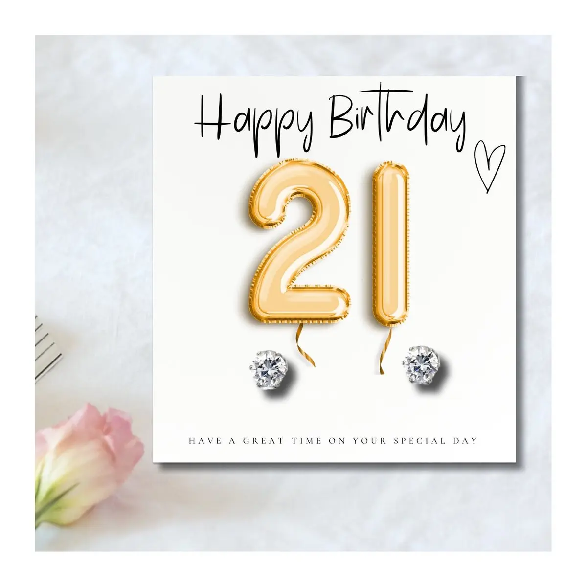 Silver cubic zirconia stud earrings with a gold balloons message card