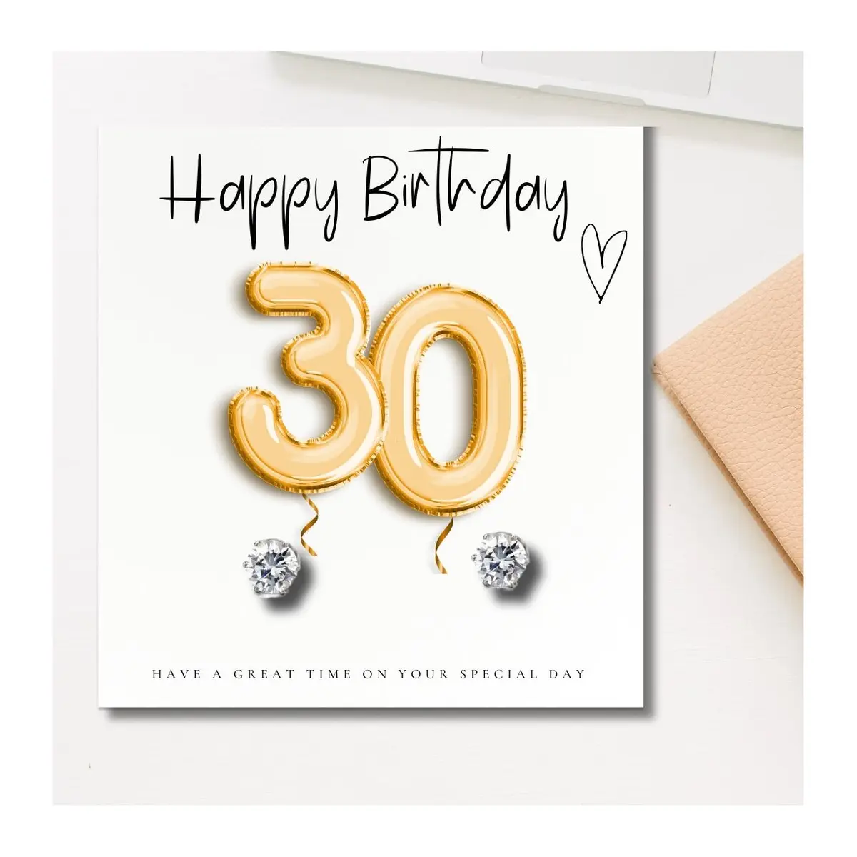 Silver cubic zirconia stud earrings with a gold balloons 30th birthday message card