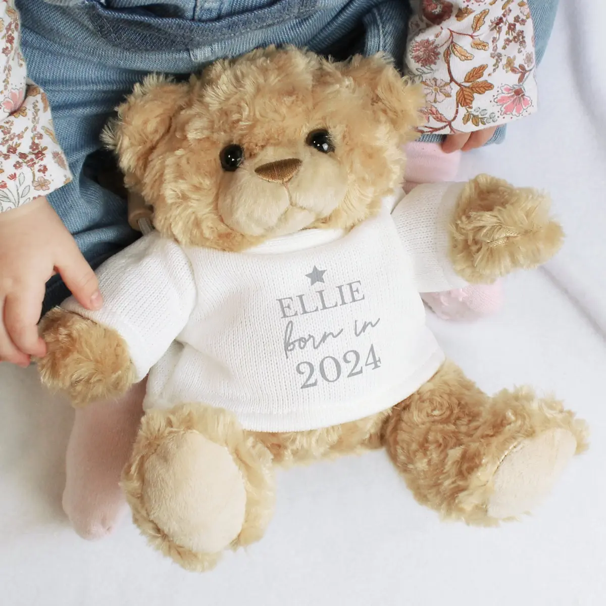 Plush teddy bear personalised with Born in text, a baby's name and year