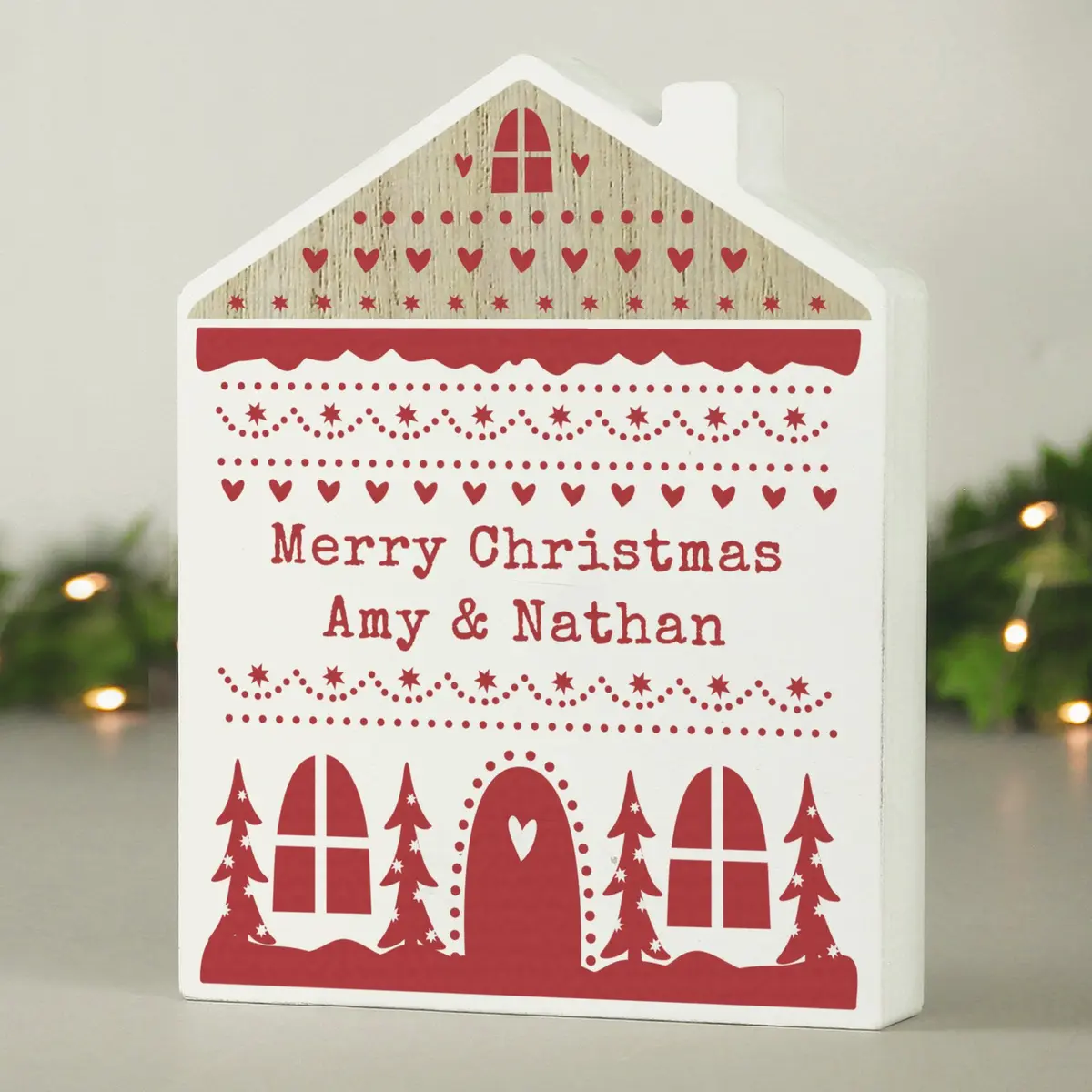 Free-standing wooden house ornament in neutral grey with a Fair Isle design