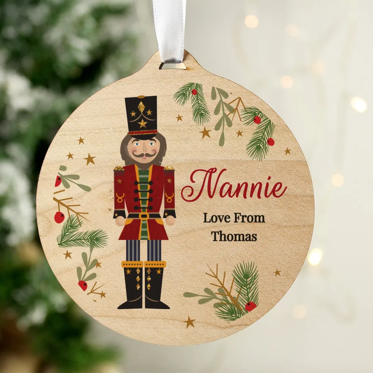 Personalised round wooden nutcracker Christmas bauble with ribbon