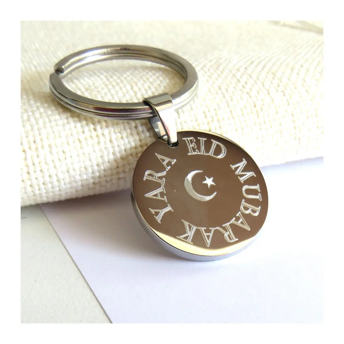 Round polished steel keyring with an Eid Mubarak crescent moon and star
