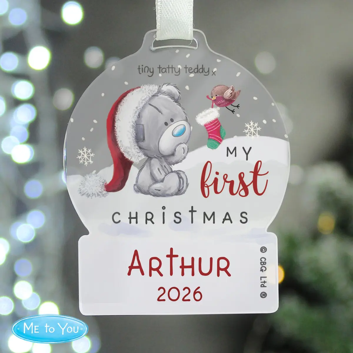 Tiny Tatty Teddy acrylic snow globe decoration with a white ribbon