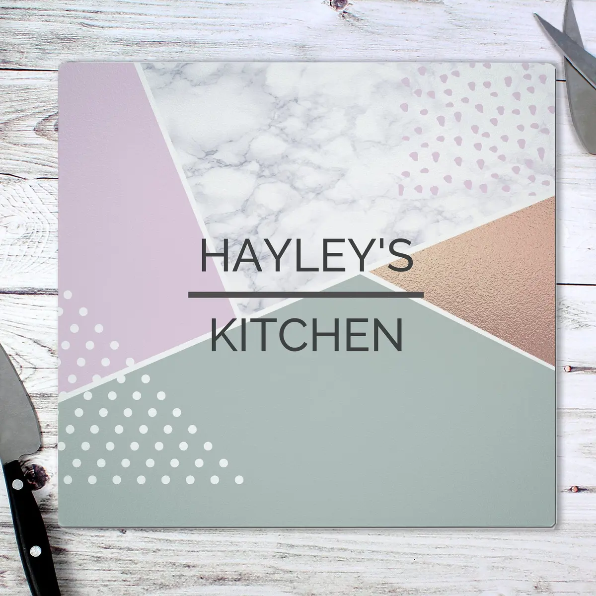 Personalised geometric glass chopping board with a two-line message
