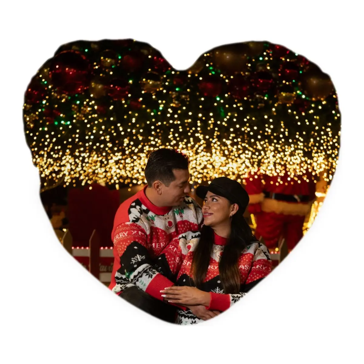 Heart-shaped cushion printed with a couple under Christmas lights