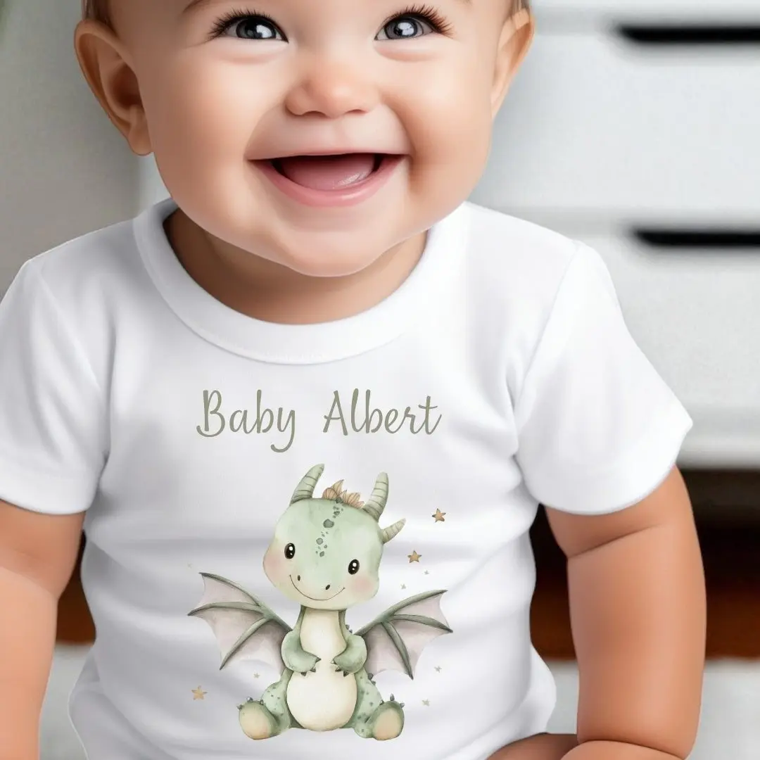 Personalised little green dinosaur baby grow with a name on it