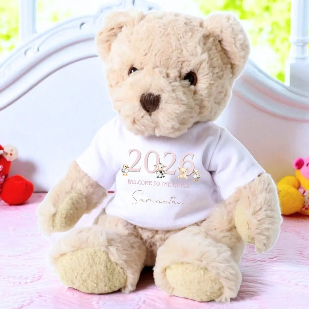 Teddy bear with a printed T-shirt of cute farm animals and 2026 Welcome to the World