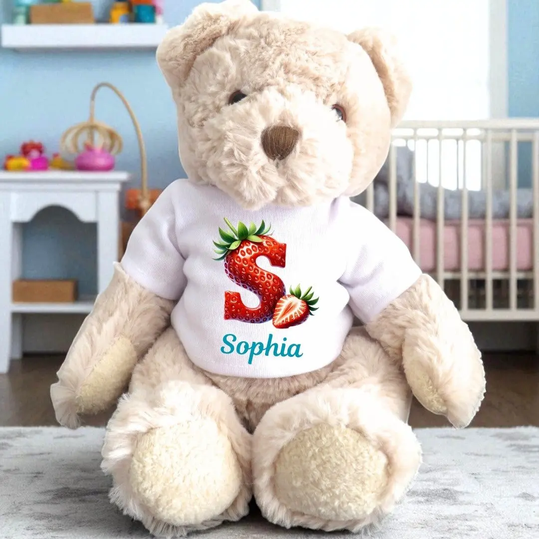 Personalised teddy bear in a T-shirt with a strawberry initial design and a name