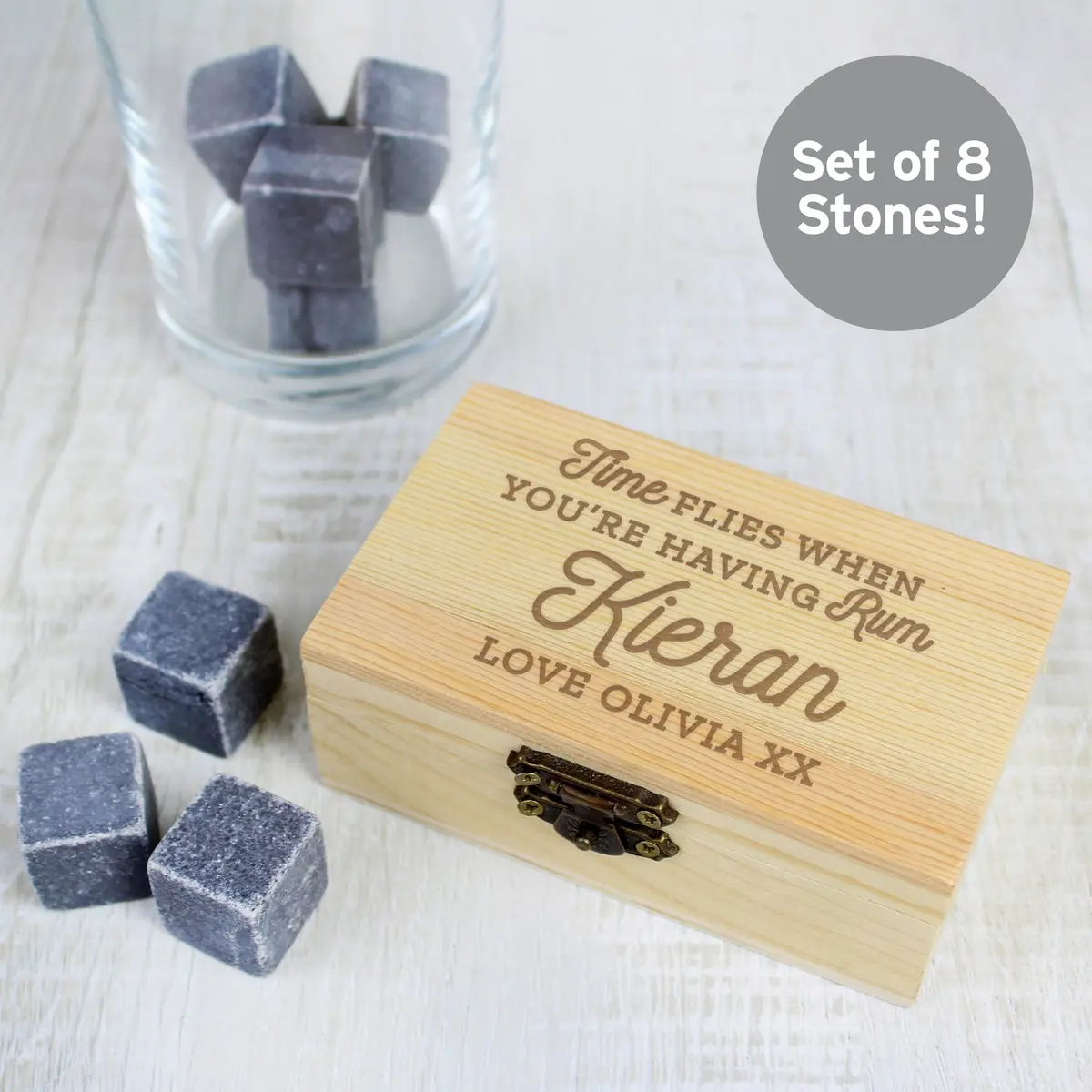 Cooling stones in a wooden clasp box with a Time Flies When You're Having Rum message